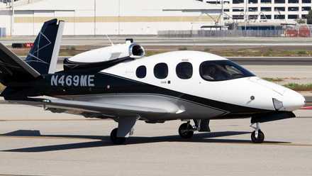 A Cirrus Vision Jet SF50 on an airport apron.