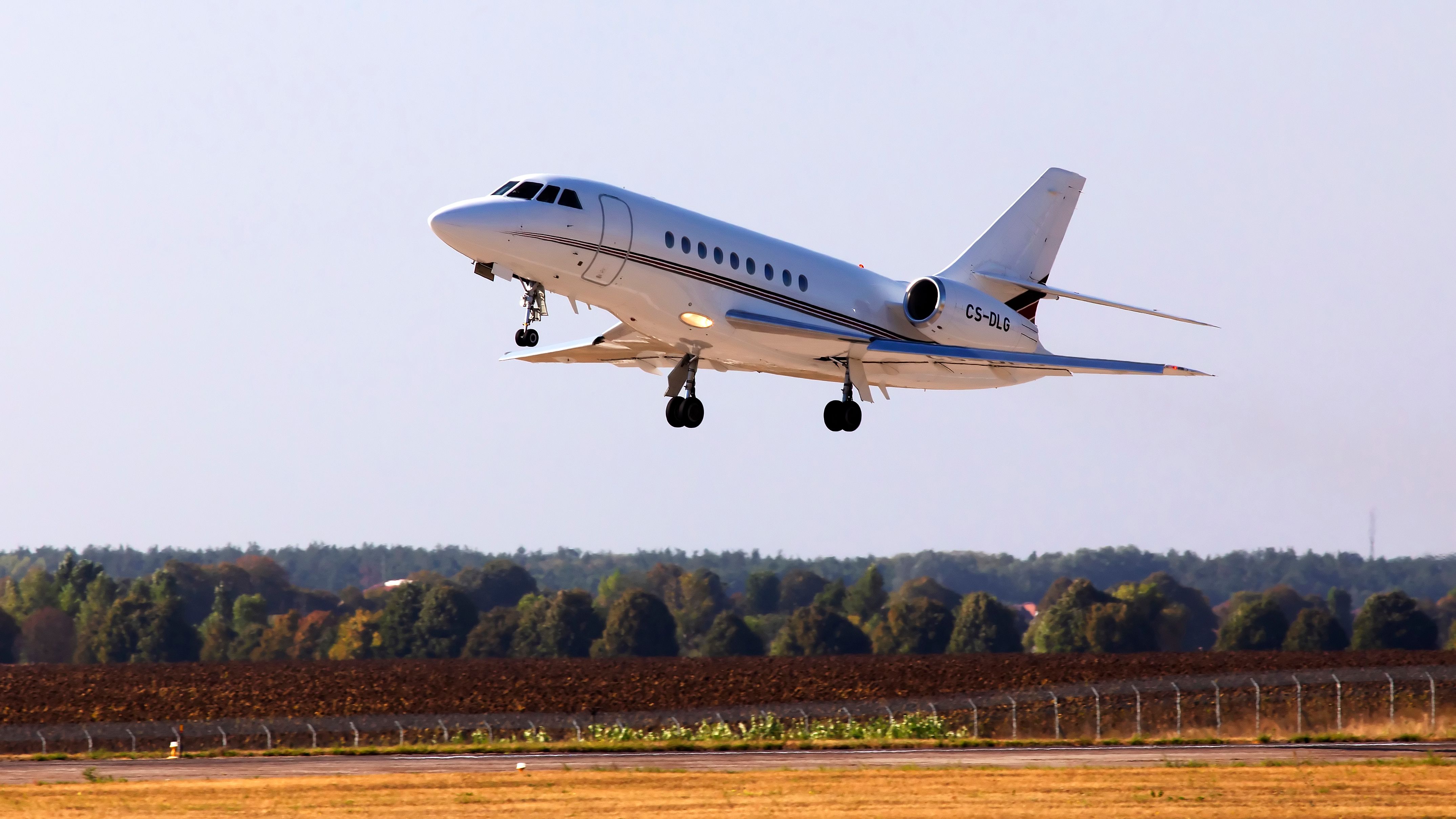 A NetJets Europe Dassault Falcon 2000 aircraft just after it takes off.