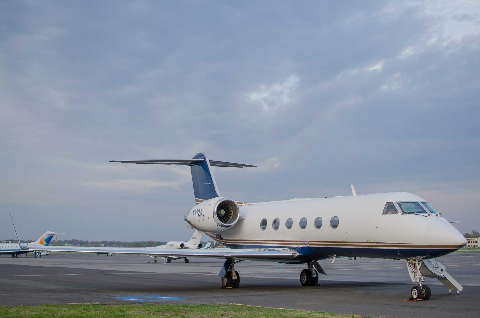 A Private jet on an airport apron.