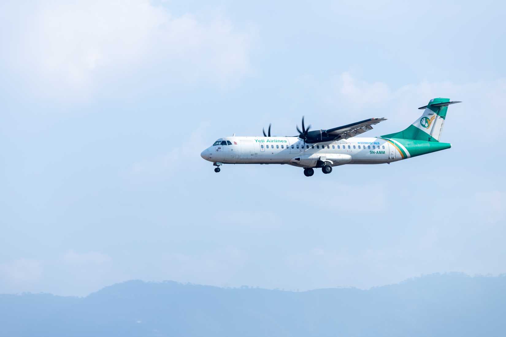 A Yeti Airlines ATR 72-500 Flying in the sky.
