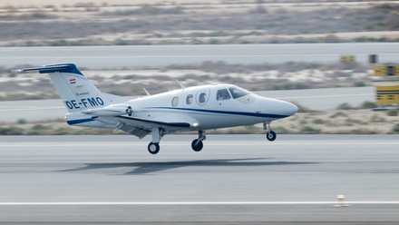 A Mali Air Eclipse 550 about to land on a runway.