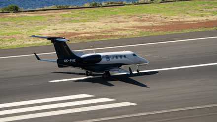 An Embraer Phenom 300E On a runway.