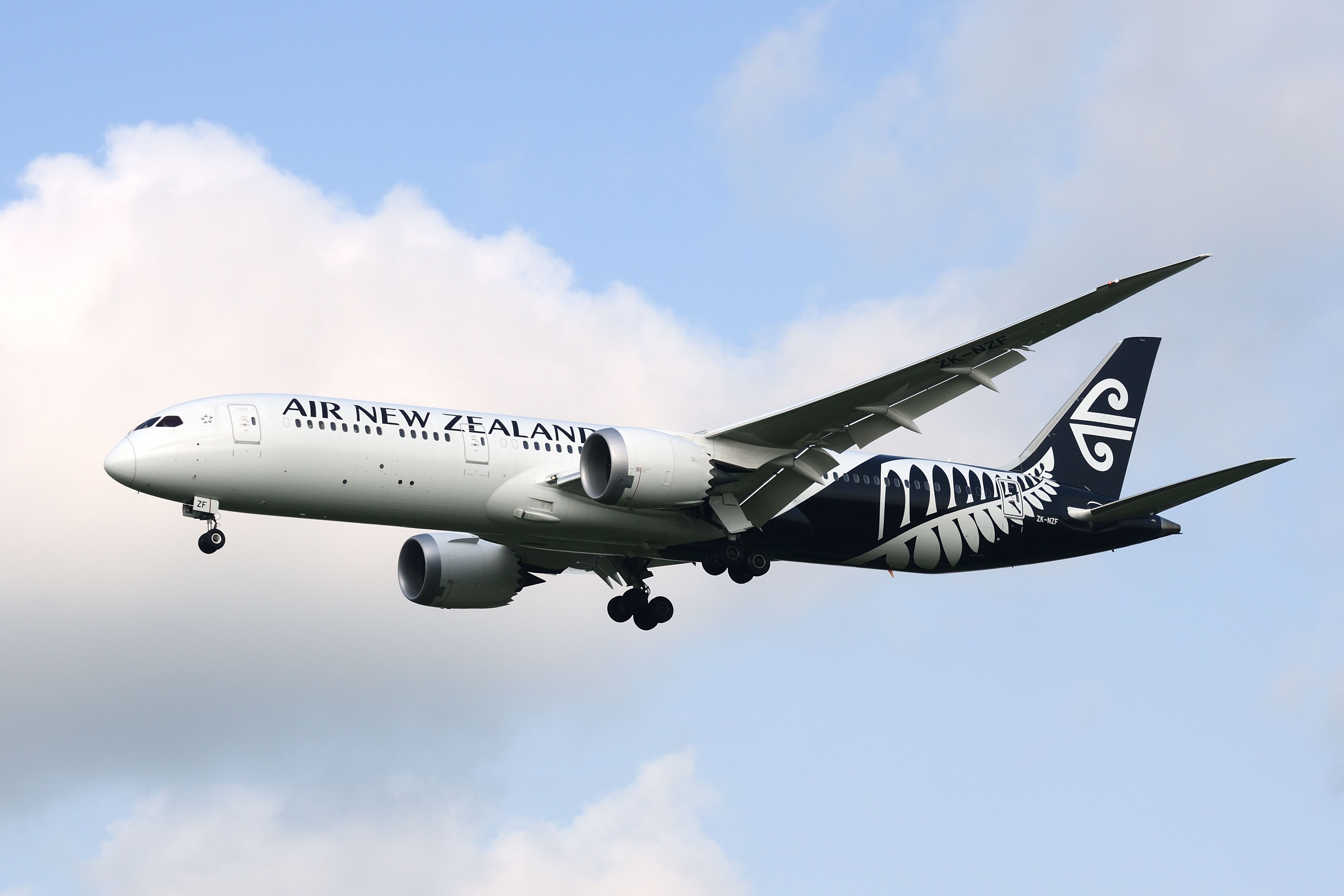 An Air New Zealand Boeing 787-9 Dreamliner flying in the sky.