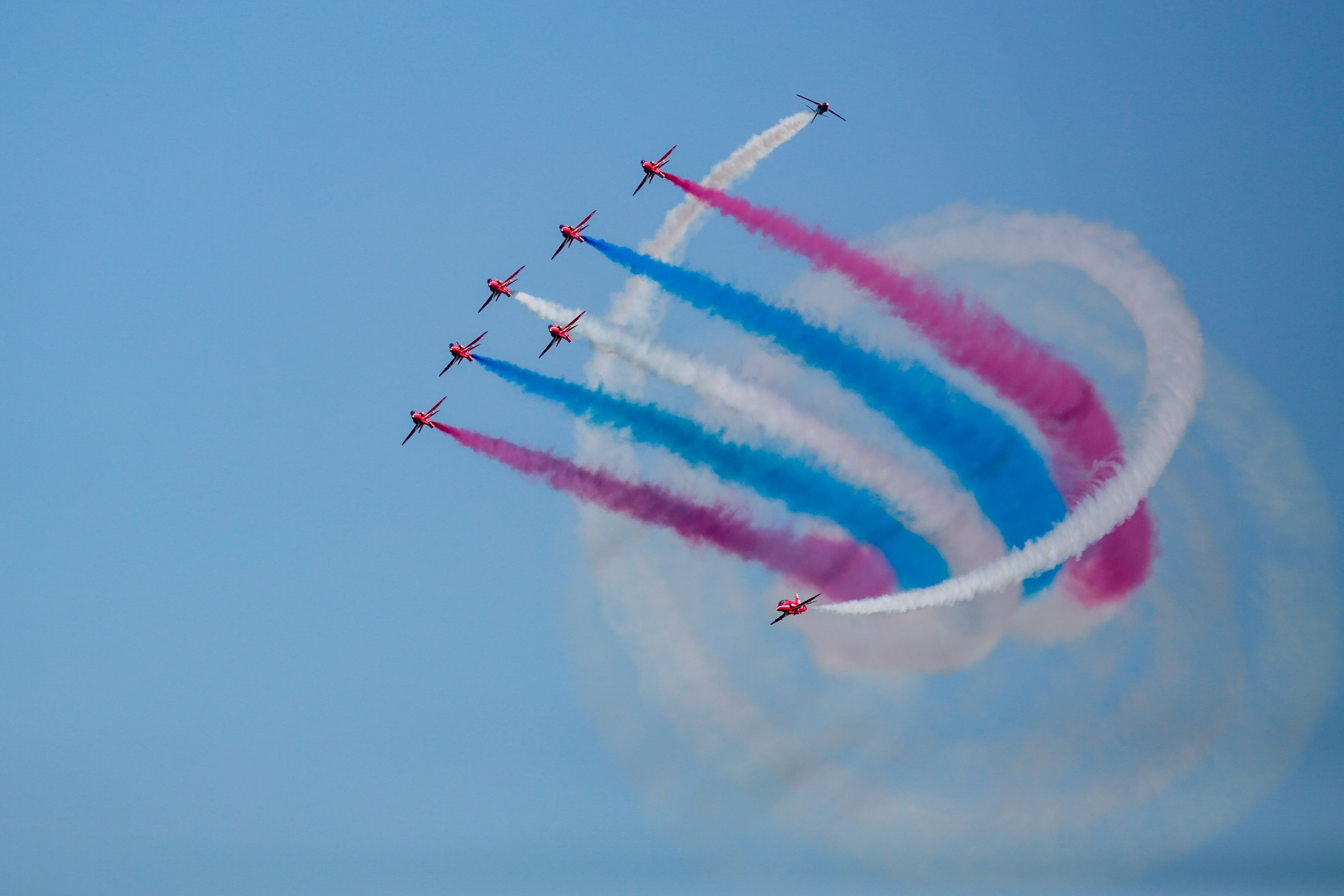 The Red Arrows Showcasing A Spiral Smoke Maneuver.