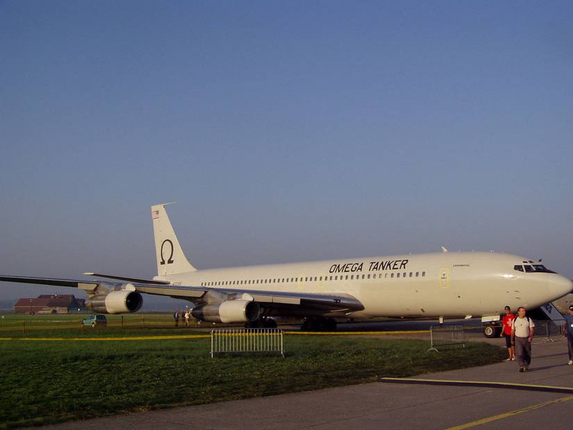 An Omega tanker aircraft on an airport apron.