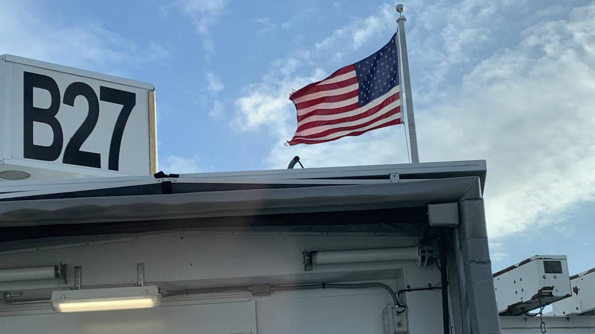 Why Do Two Gates At Boston Logan International Airport Have American Flags Fixed To Them?