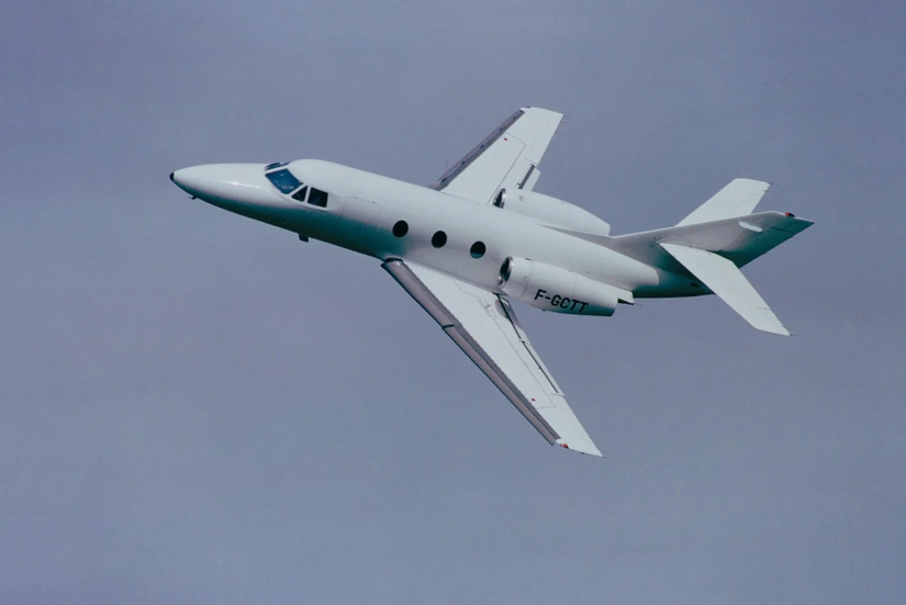 A Dassault Falcon 10 flying in the sky.