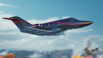 A HondaJet flying in the sky.