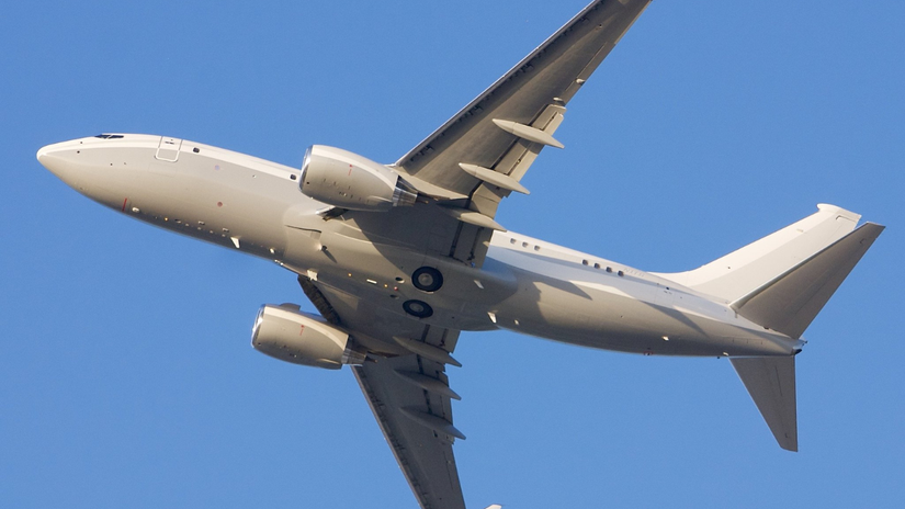 A Boeing Business Jet BBJ 737 flying overhead.