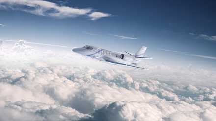 A Cessna Citation Ascened flying in the sky.