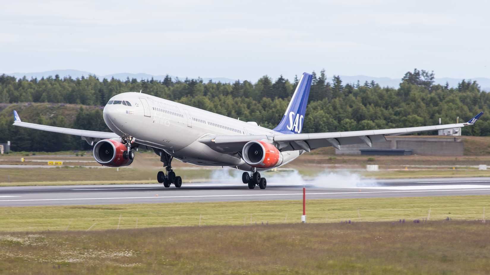SAS A330-300 touching down shutterstock_2193477459