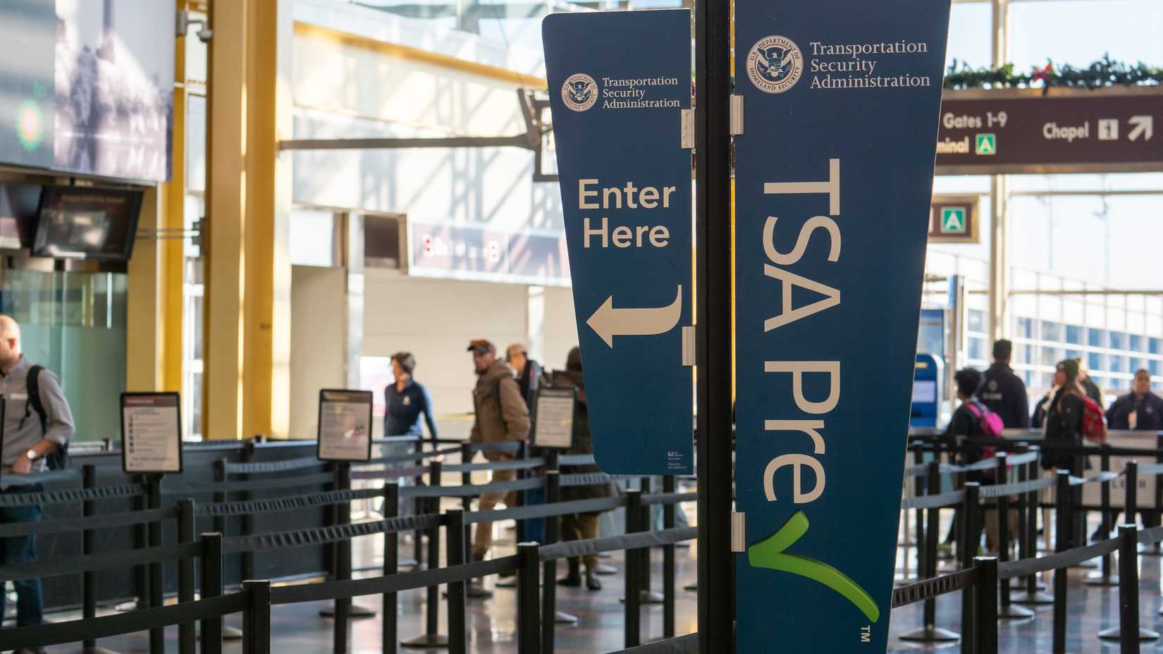 A TSA PreCheck Sign Located At An Airport