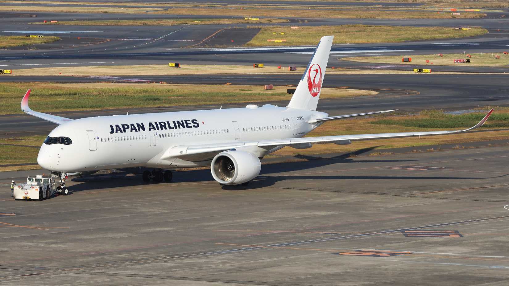 Japan Airlines Airbus A350-900 being pushed back at HND shutterstock_2289767489