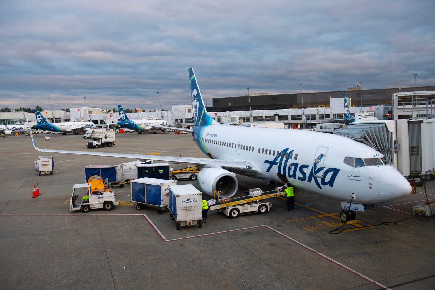 Alaska Airlines Boeing 737-700 parked at a gate at SEA shutterstock_1706501302