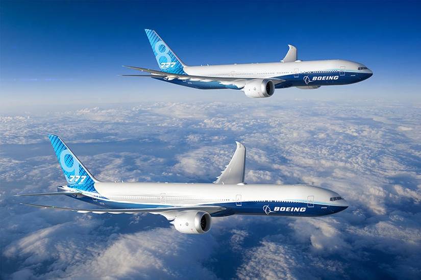 Two Boeing 777X's next to each other.