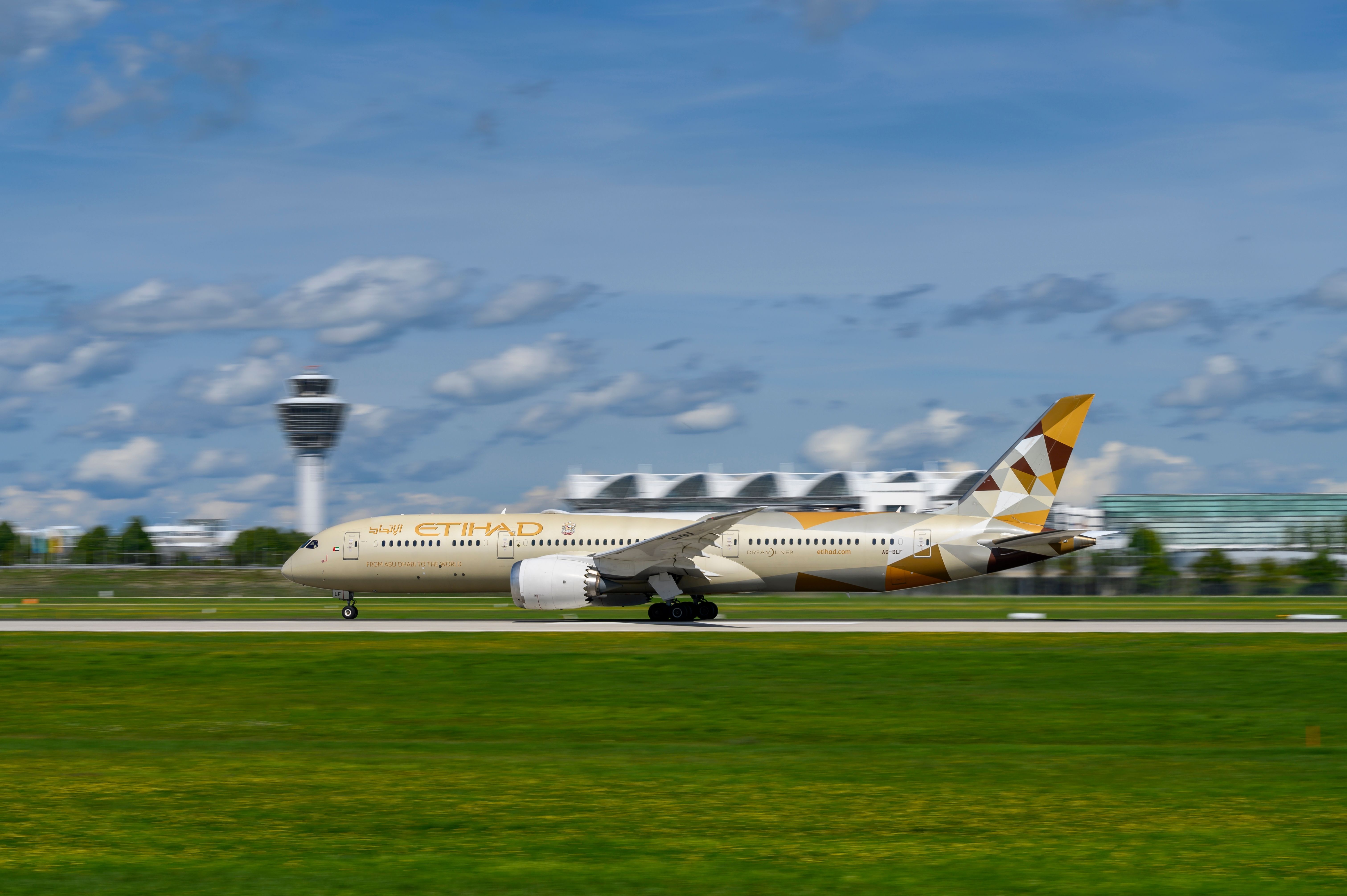 Etihad Airways Boeing 787-9 Dreamliner with the aircraft registration A6-BLF is starting on the southern runway 26L of the Munich airport MUC EDDM