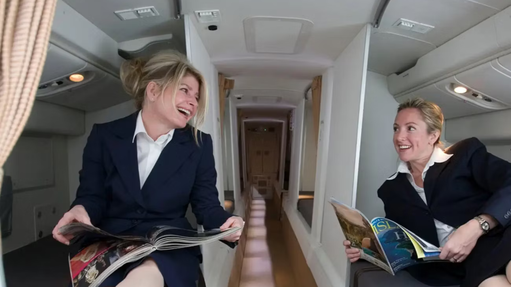 Two Cabin crew members relaxing in the crew rest area