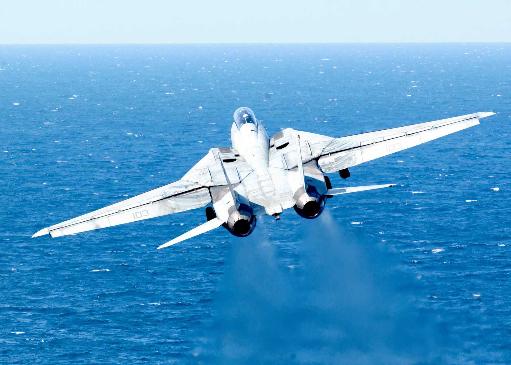 F-14 taking off from its aircraft carrier.