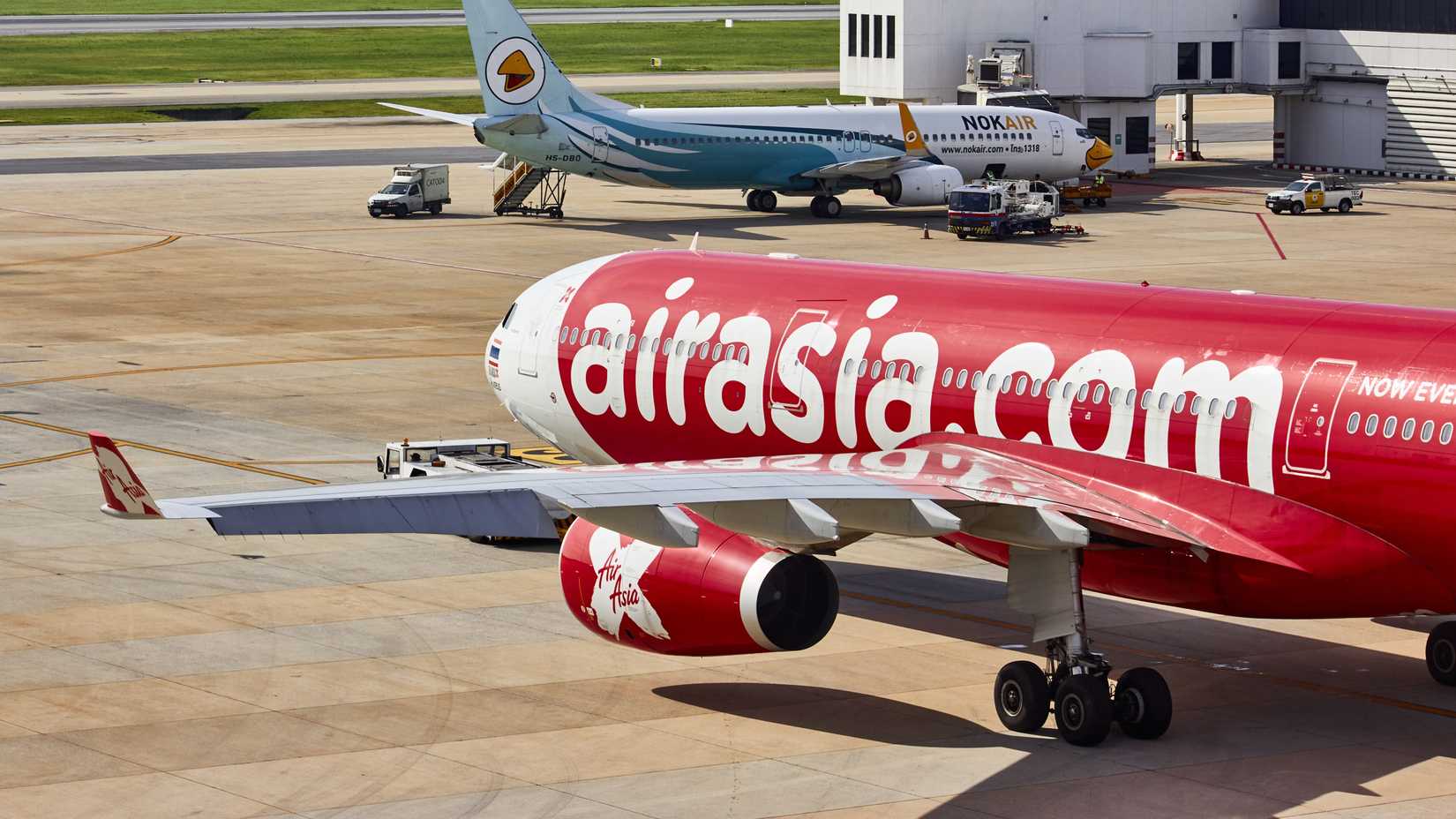 A Thai AirAsia X Airbus A330-300 (registration HS-XTE), leaving the gate.