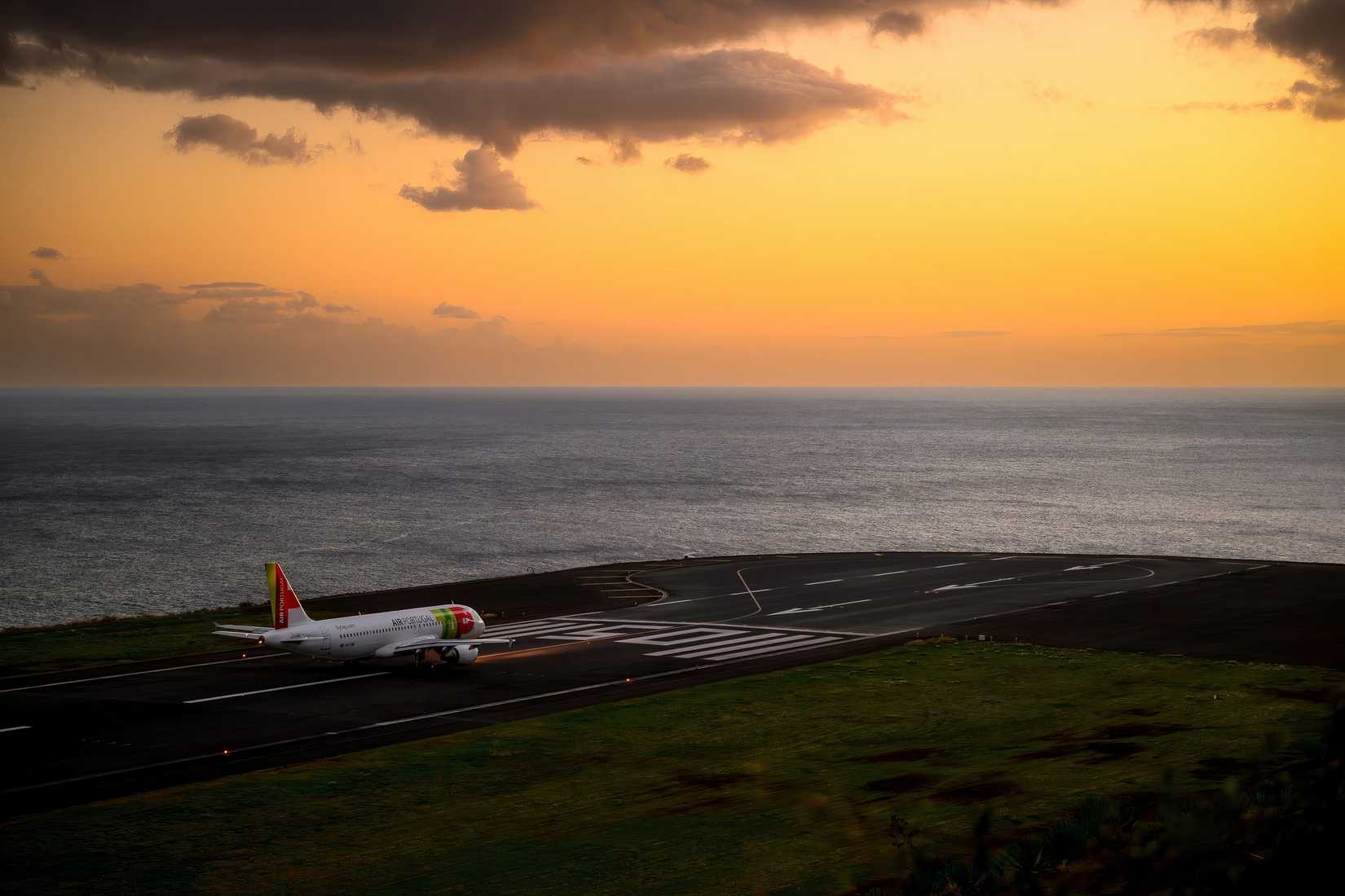 Sunset with TAP Portugal Airbus A319-111 at Funchal Cristiano Ronaldo Airport, ready for take off.