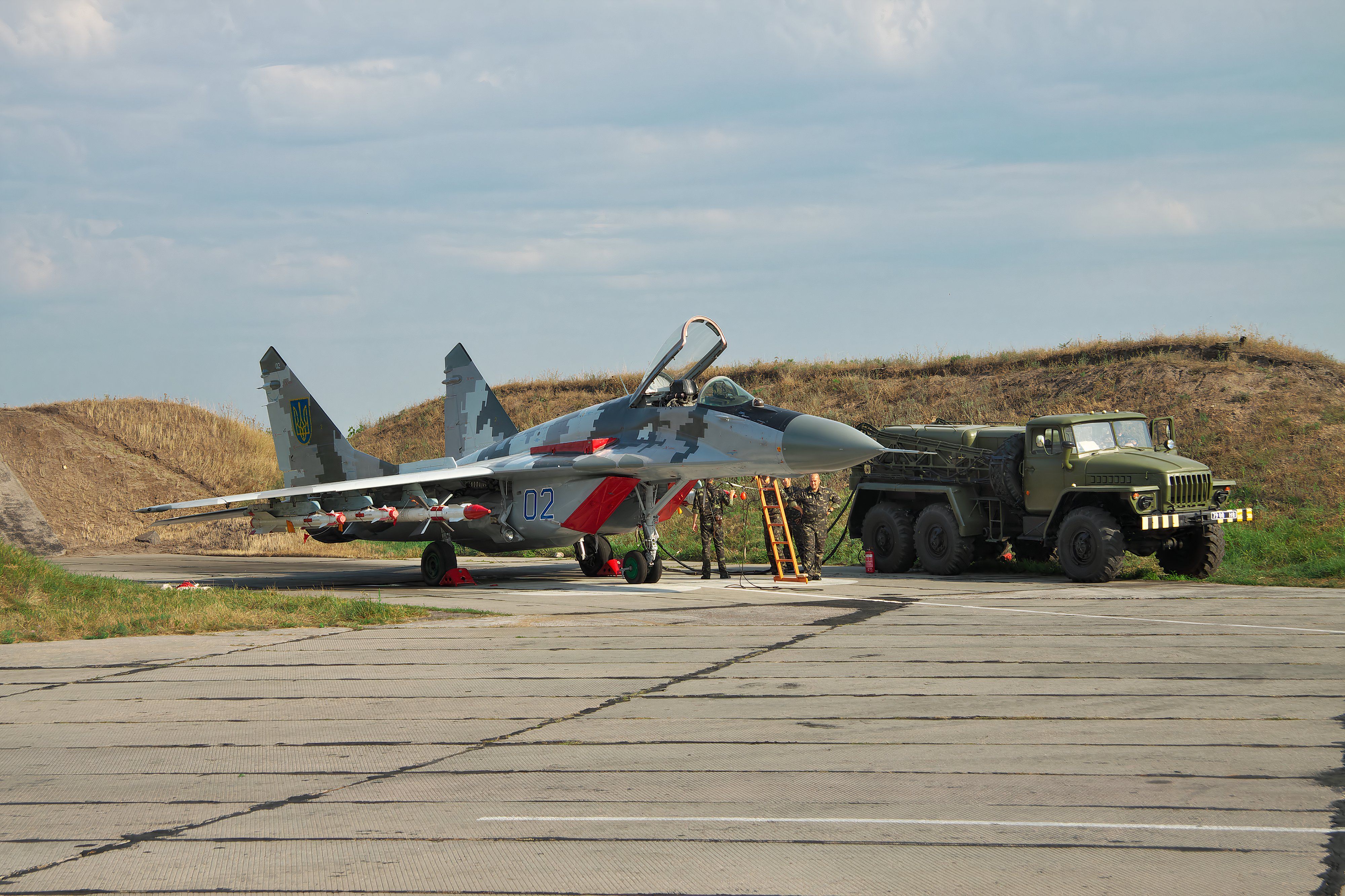 shutterstock_501303553 - Vasilkov, Ukraine - August 3, 2012: Ukrainian Air Force Mig-29 fighter plane is being prepared for a training flight with its weapons attached