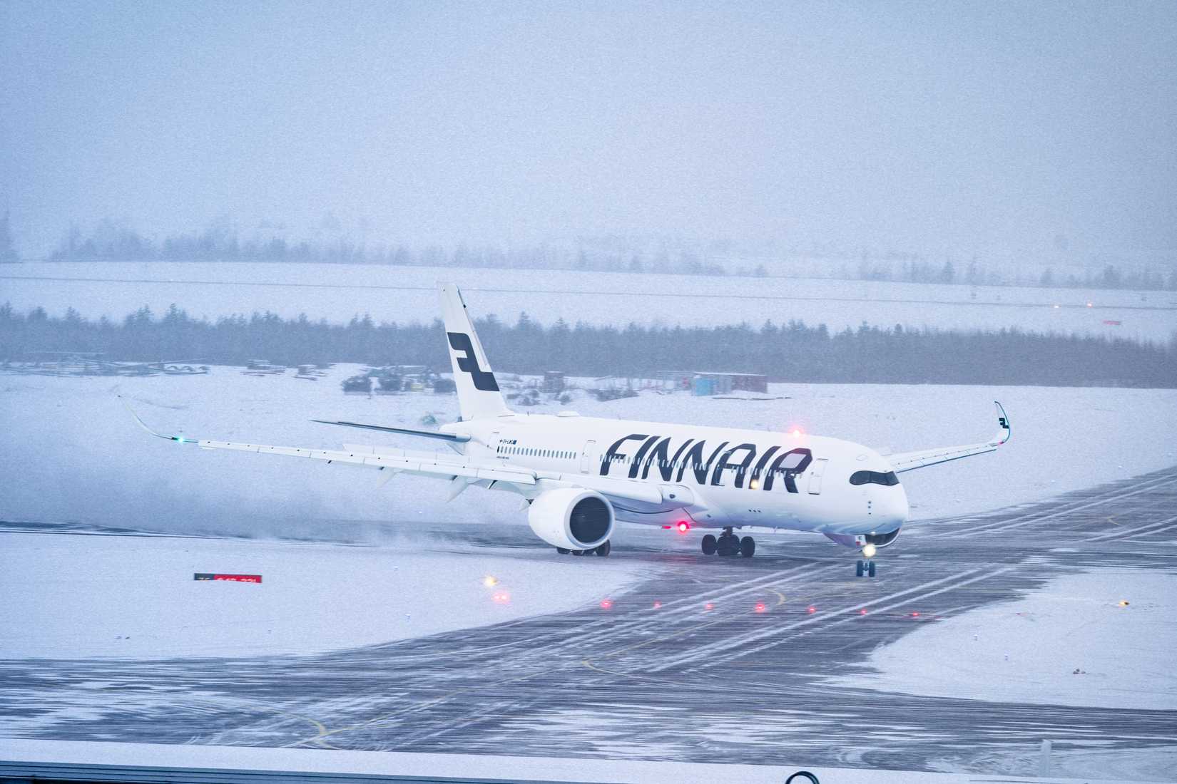 Finnair Airbus A350-900 taxiing at Helsinki Airport HEL shutterstock_2436221511