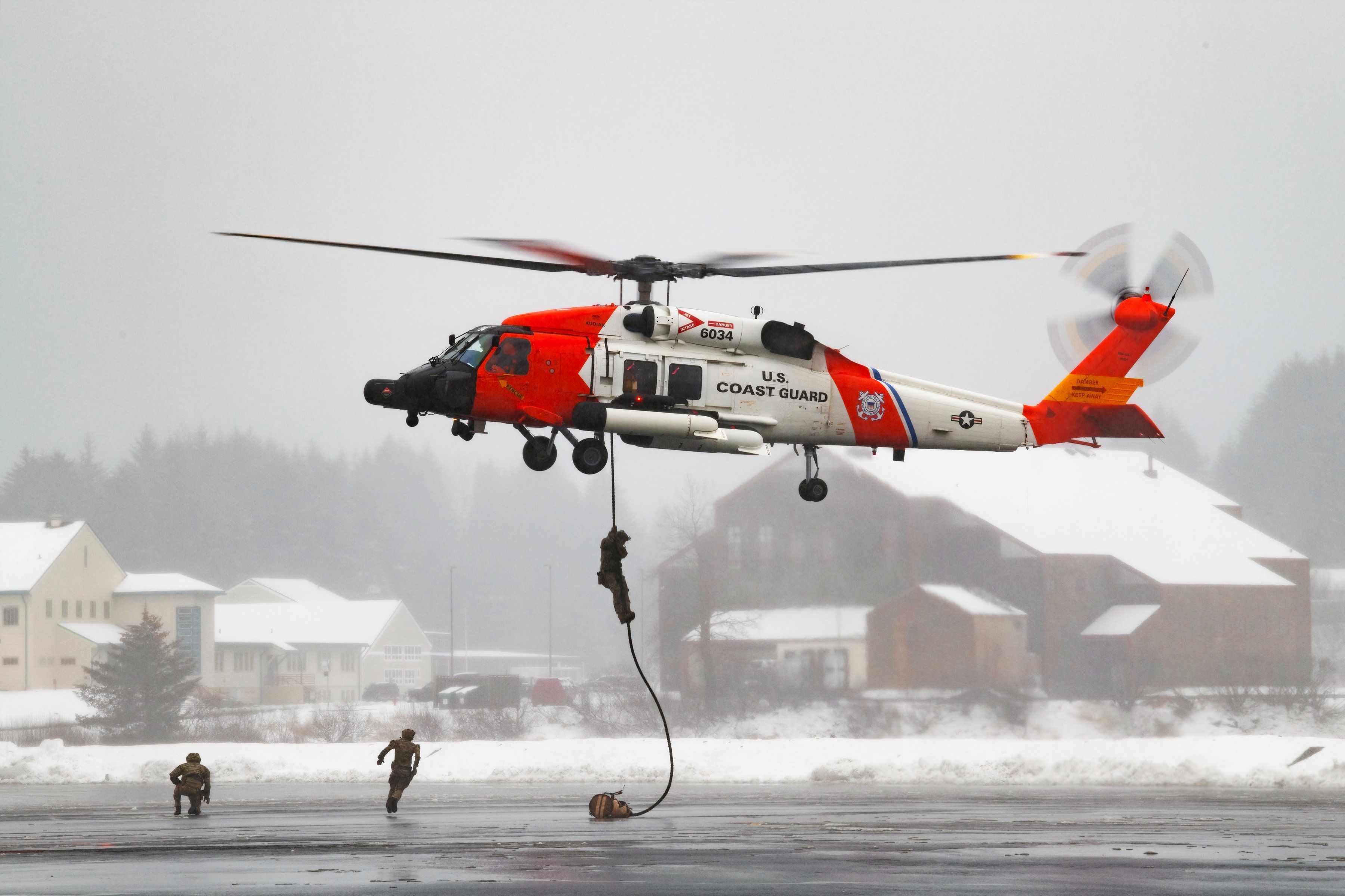 8269872 - Sikorsky MH-60T Jayhawk conducing rappel in snowy Kodiak, Alaska