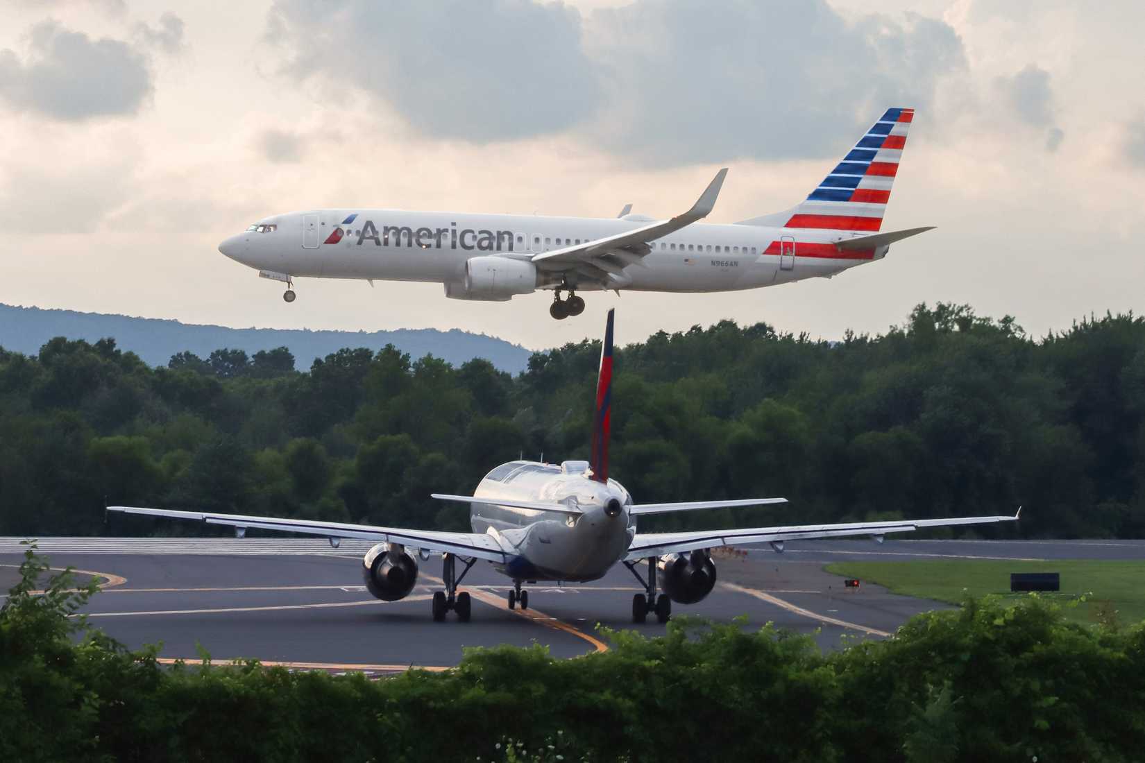 American Airlines and Delta Air Lines aircraft at BDL shutterstock_2334383357