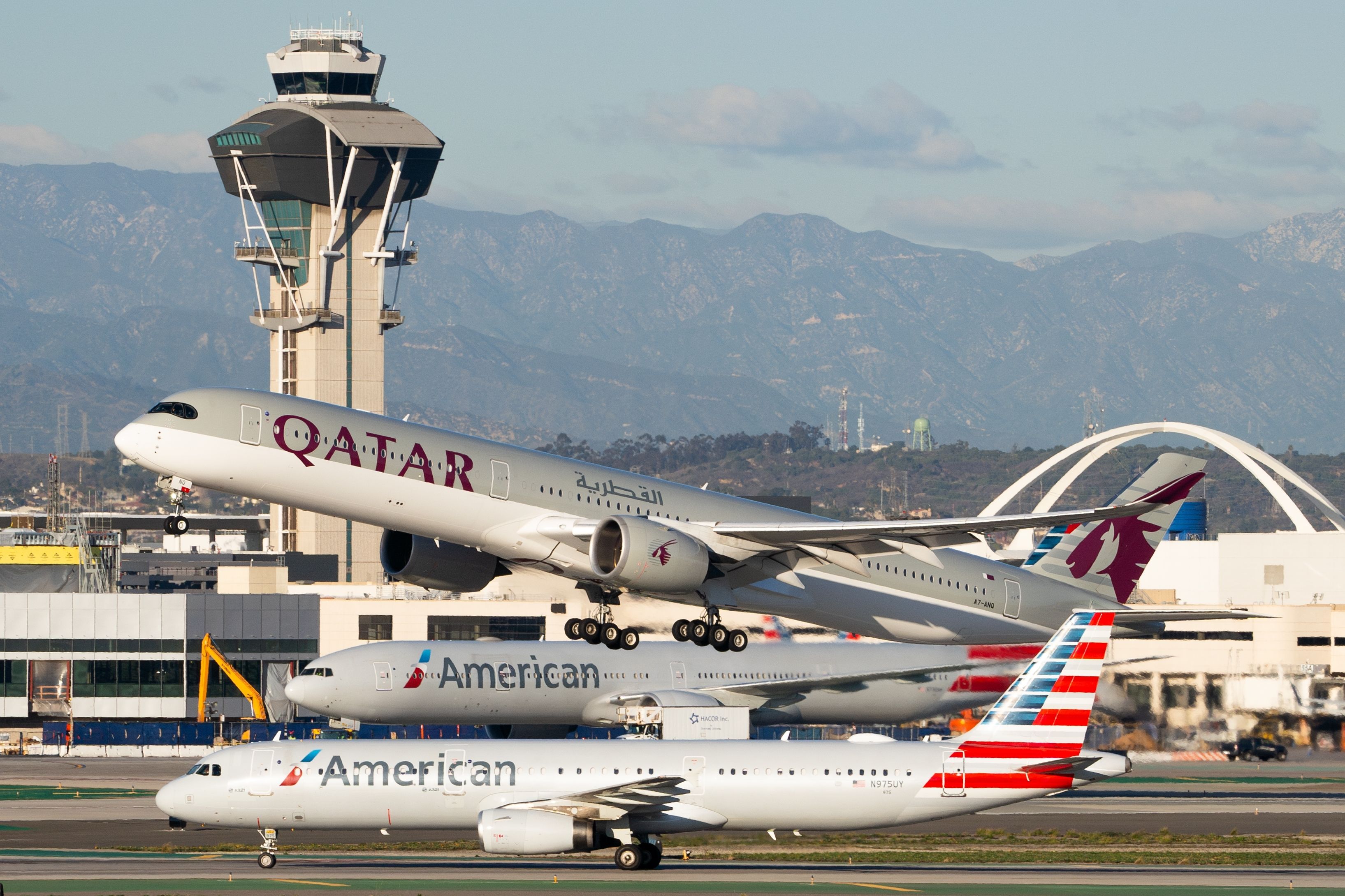 Qatar Airways and American Airlines aircraft at Los Angeles International Airport LAX shutterstock_2430553663