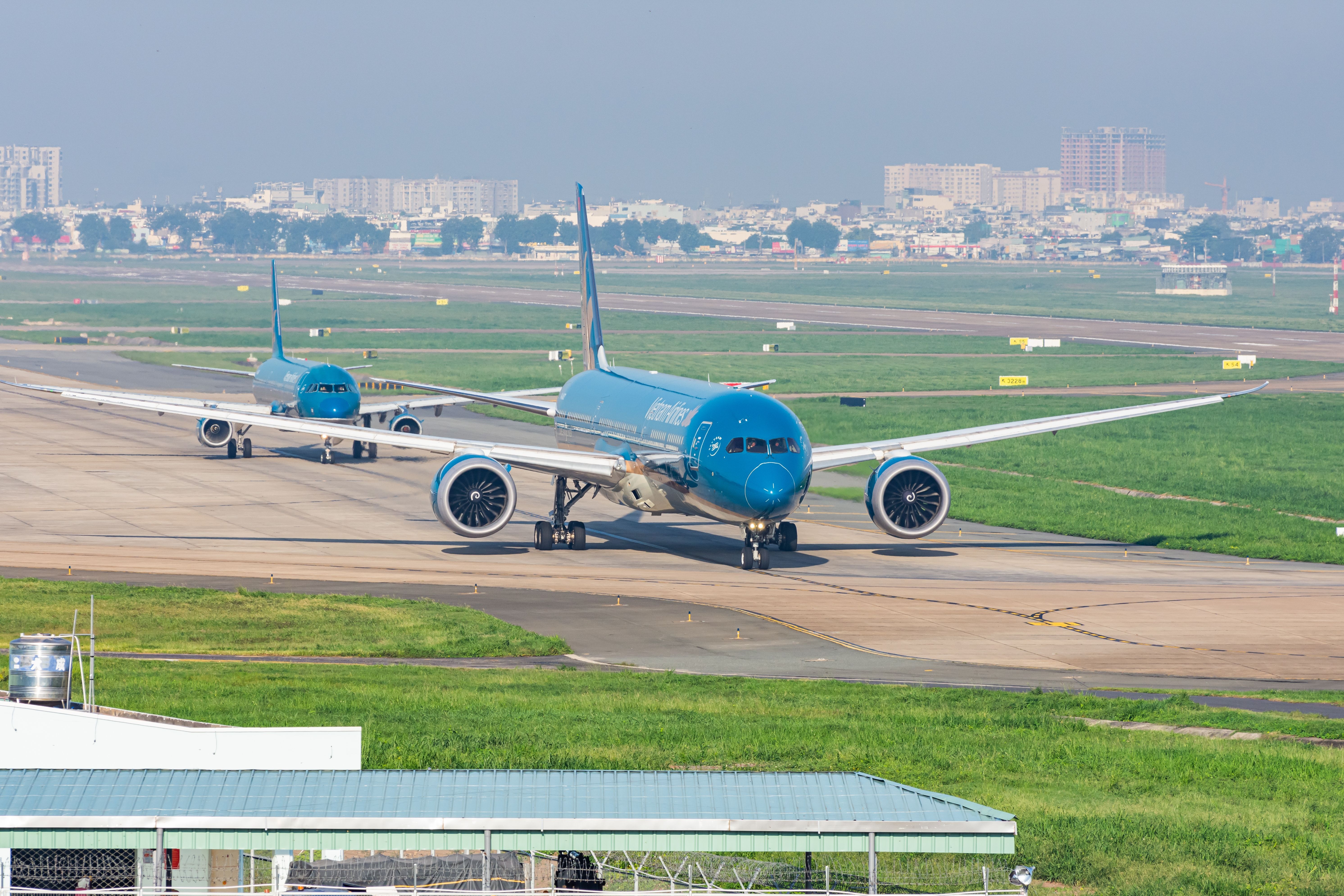 Vietnam Airlines Planes Taxiing In Ho Chi Minh City