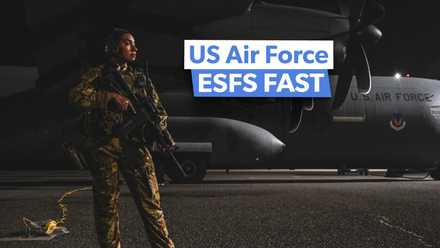 3_2 Airman assigned to the 386th Expeditionary Security Forces Squadron Fly Away Security Team stands watch next to a C-130J Super Hercules