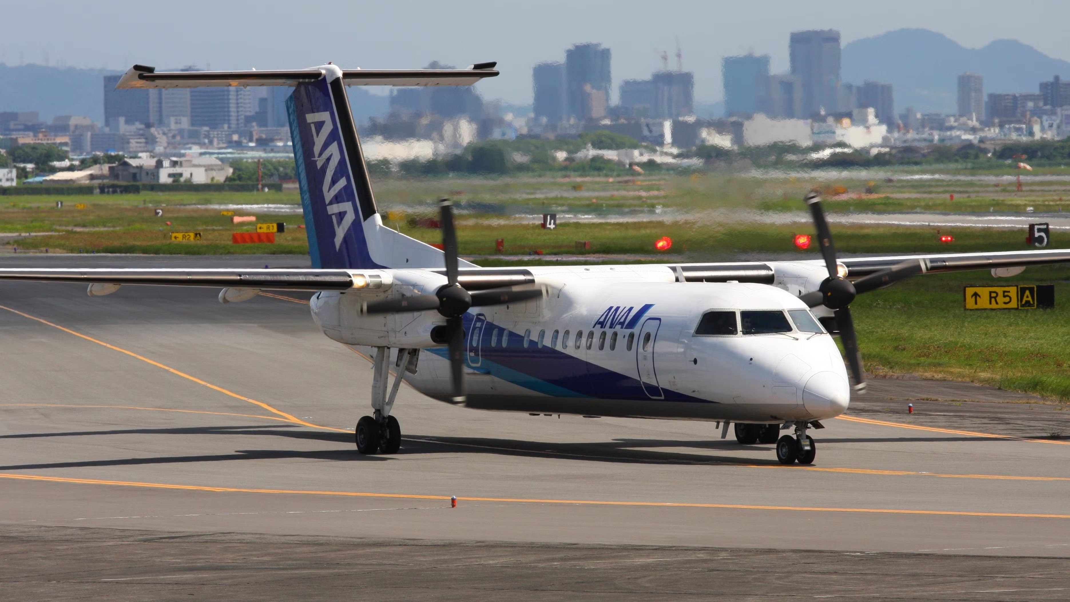 ANA Dash 8-400 Grounded After Hitting Jet Bridge At
