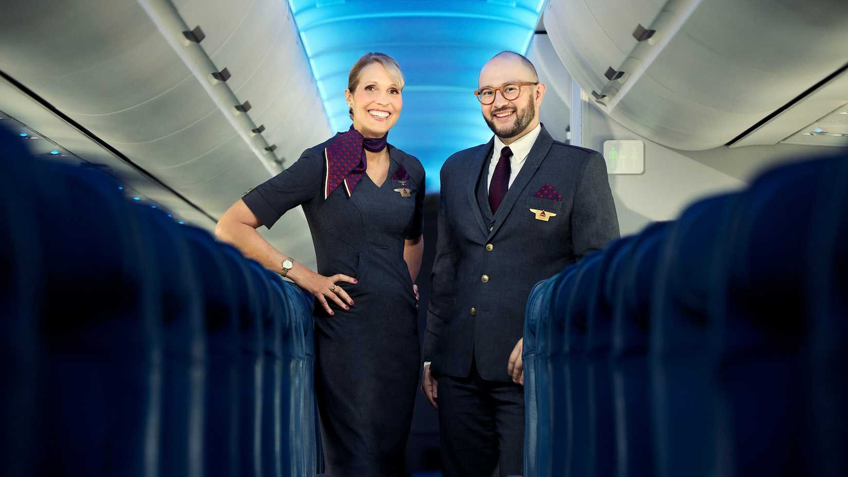 flight attendants in aircrft aisle