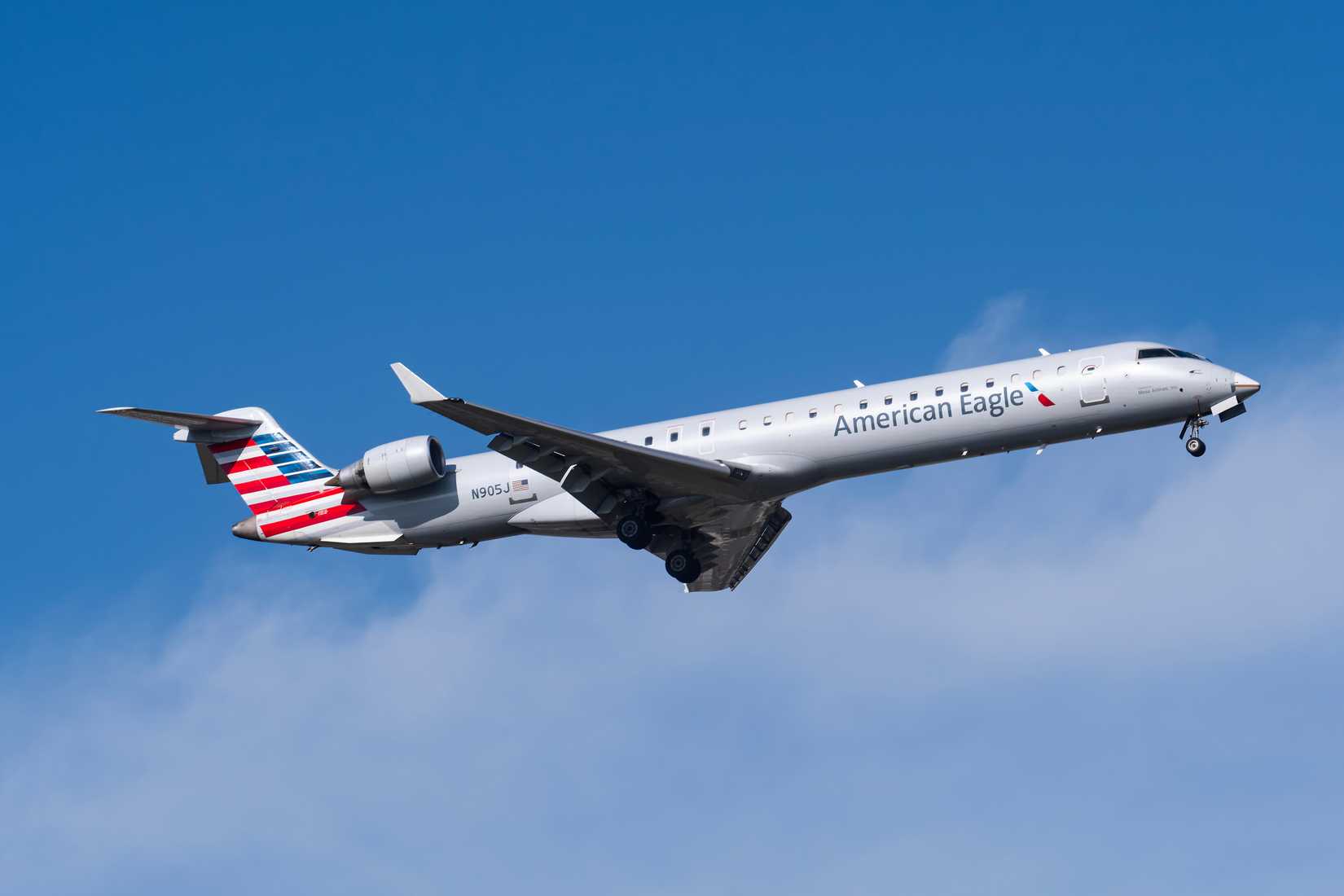 American Airlines (American Eagle) Mitsubishi CRJ900 departing DFW shutterstock_2490994119