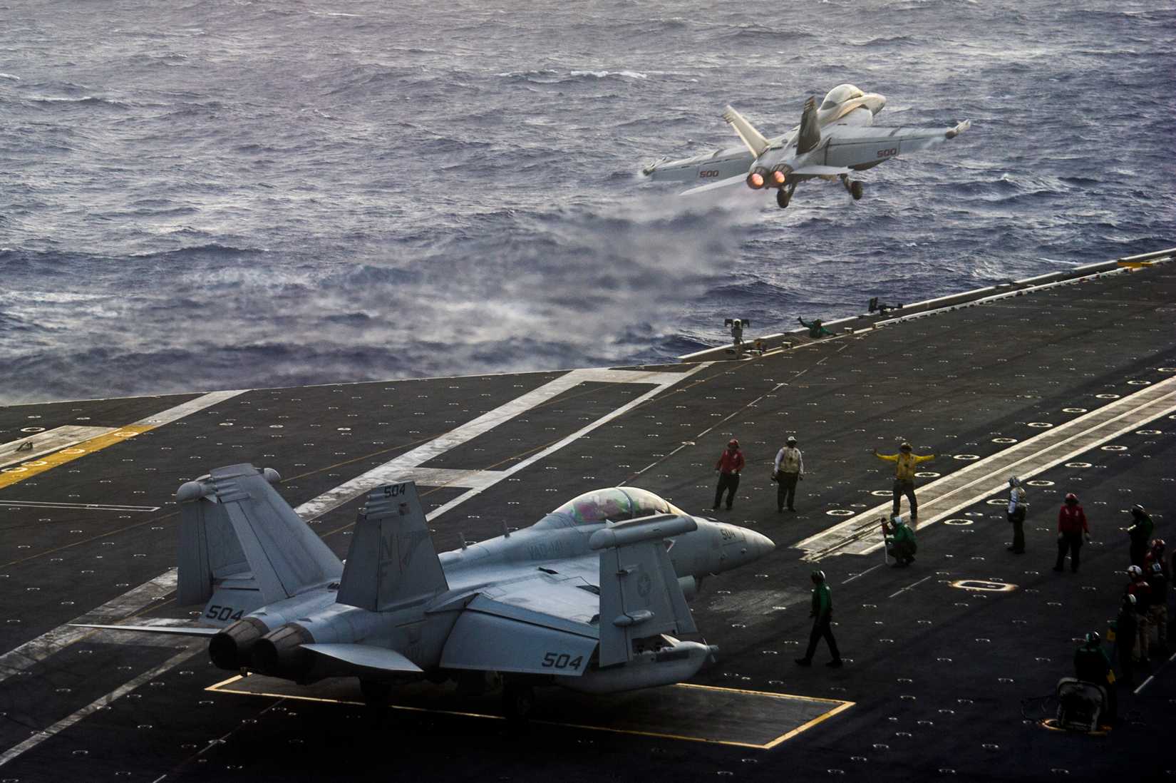 An EA-18G Growler from the Shadowhawks of Electronic Attack Squadron (VAQ) 141 launches from the flight deck of the U.S. Navy's forward-deployed aircraft carrier USS George Washington (CVN 73)
