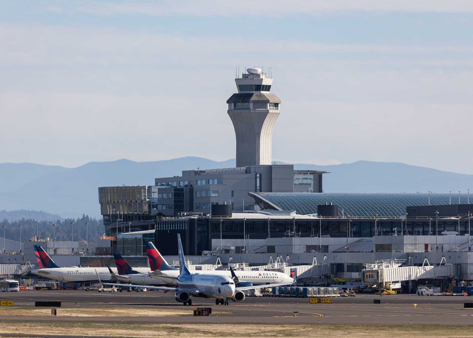 ATC tower at Portland International Airport PDX shutterstock_2537125193
