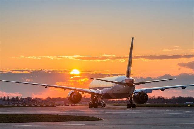 Birish Airways jet taxis during sunset at Heathrow