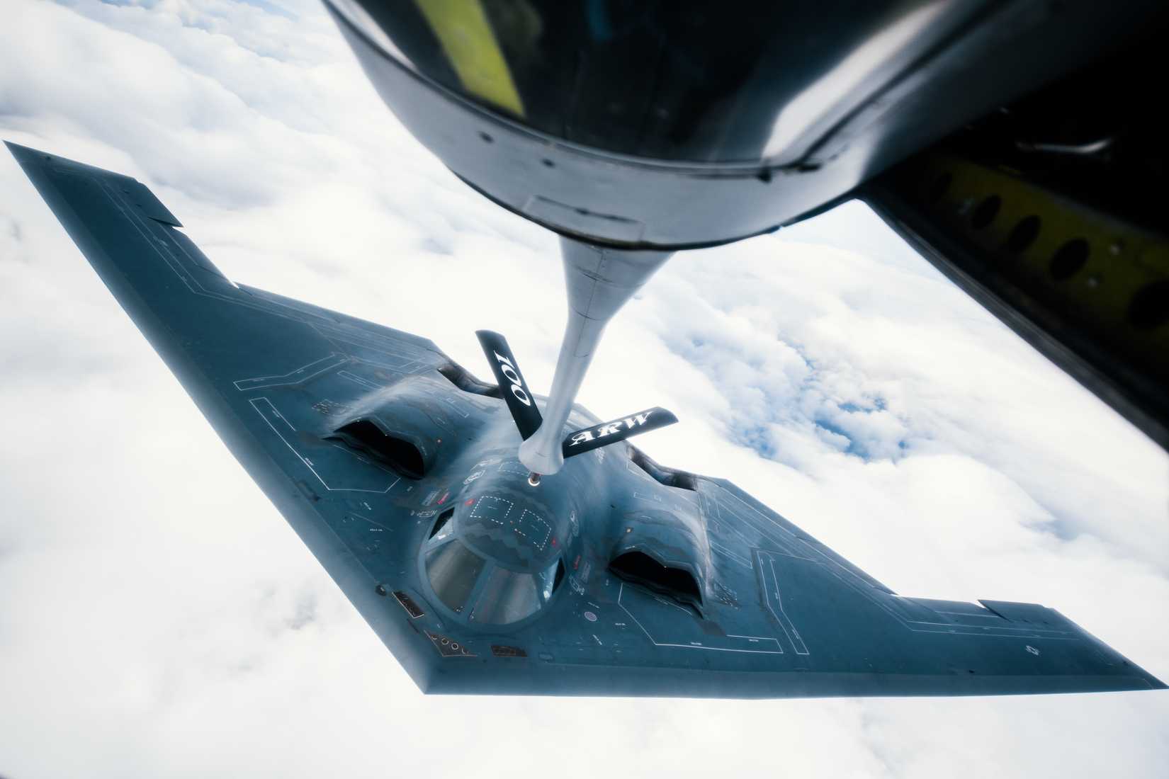 509th Bomb Wing B-2 Spirit approaches to refuel from a 351st Aerial Refueling Squadron KC-135 Stratotanker during the Bomber Task Force training exercise over England
