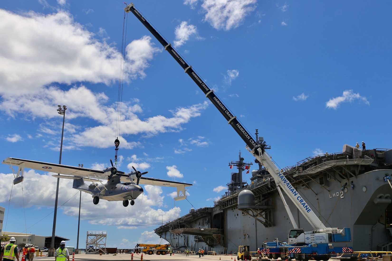 A Consolidated PBY Catalina arrives in Pearl Harbor aboard USS Essex (LHD 2) for the 75th Commemoration of the End of WWII.