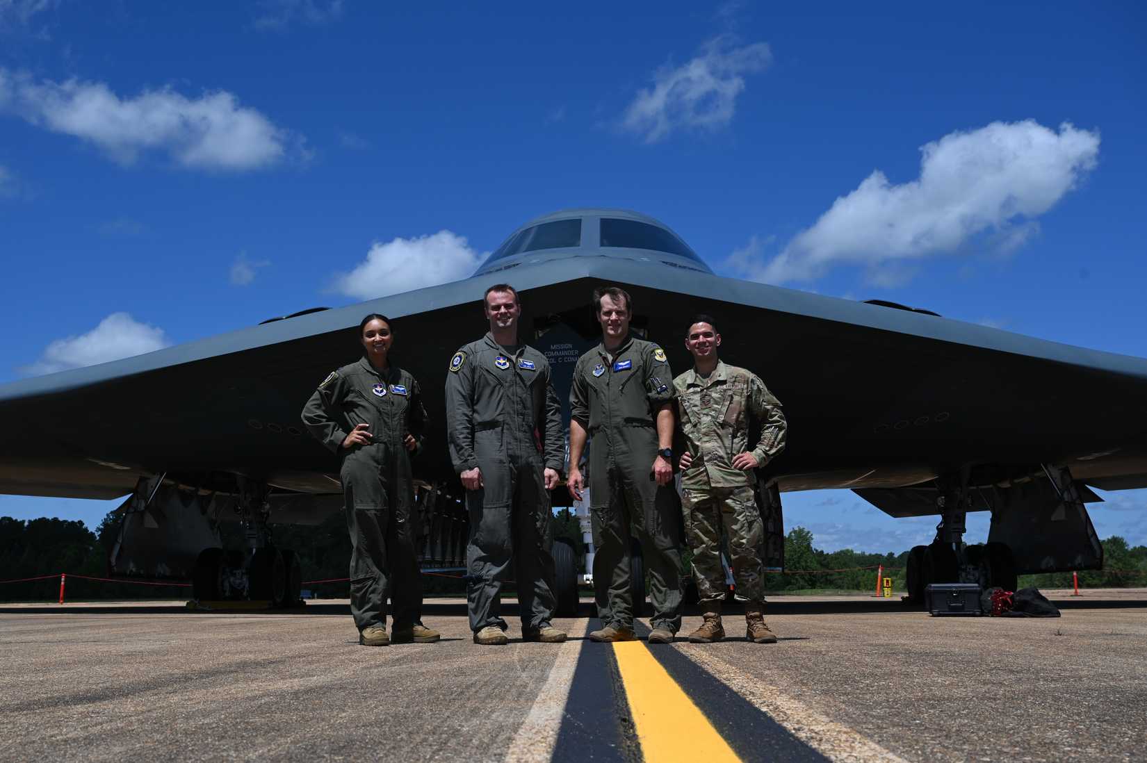 Air Force personnel, pose in front of a B-2 Spirit from Whiteman Air Force Base, Mi., during a static display, June 28, 2021, on Columbus Air Force Base, Miss
