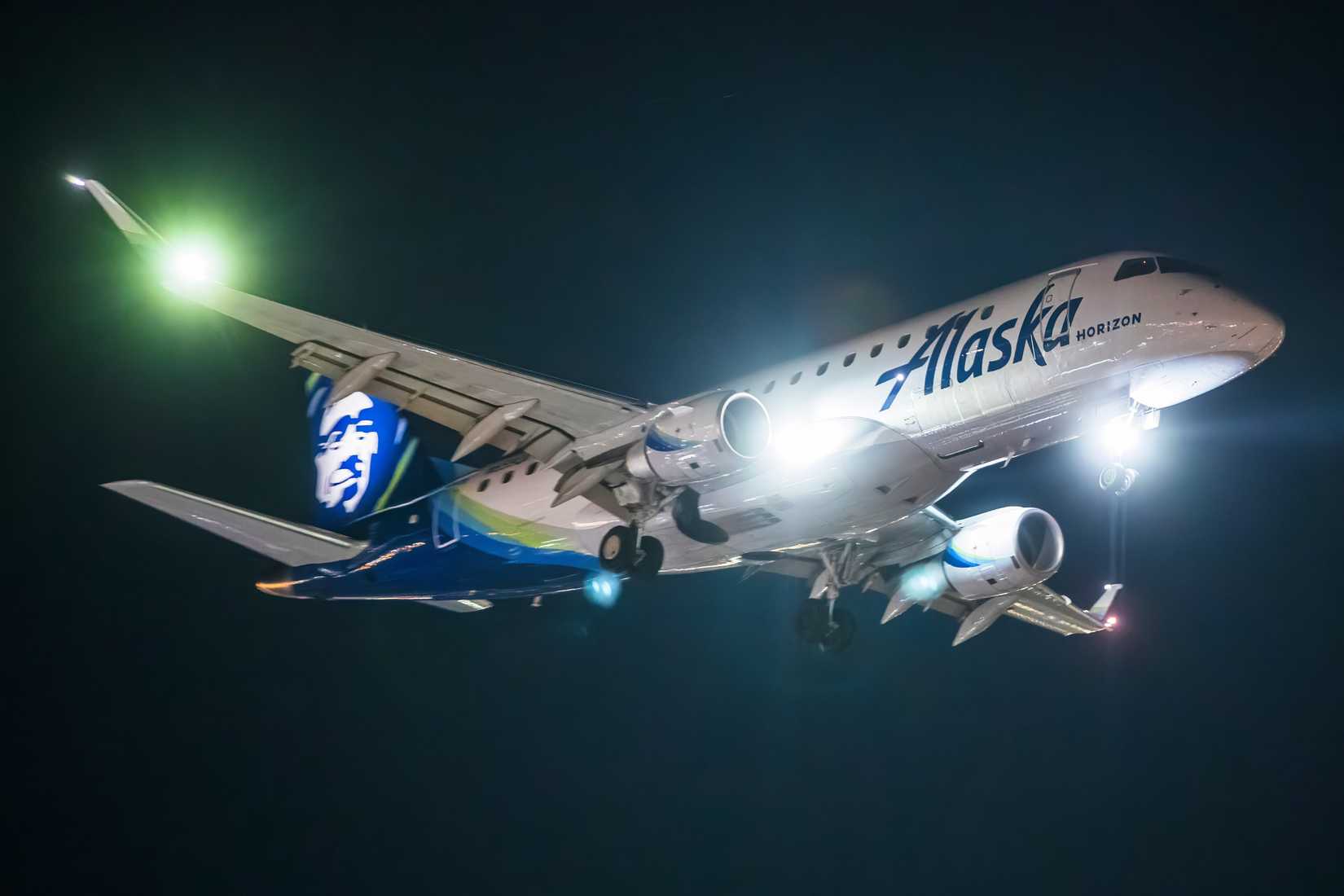 Alaska Airlines Embraer E175 landing at Los Angeles International Airport LAX shutterstock_2578733915