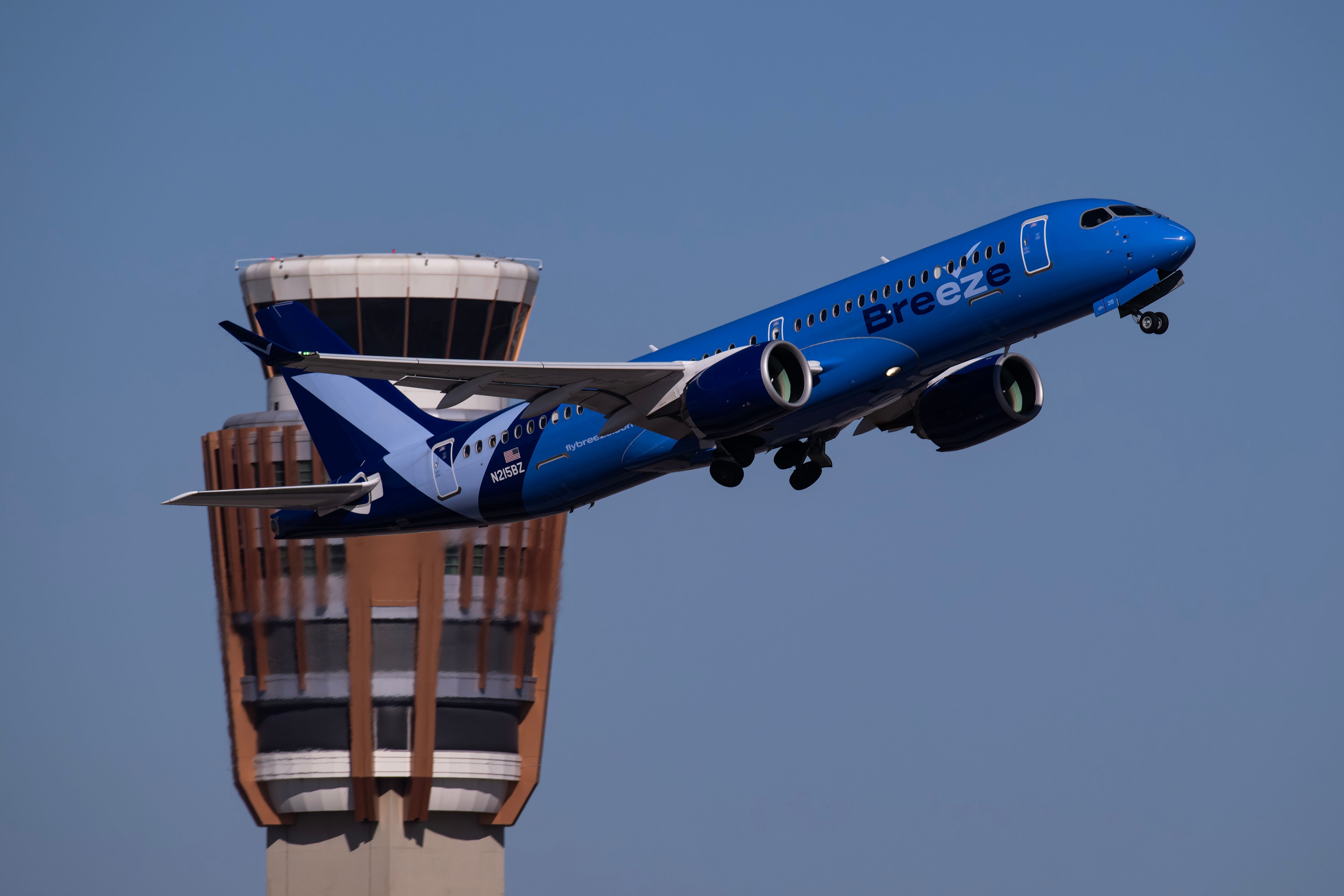 Breeze Airways Airbus A220-300 departing Phoenix Sky Harbor International Airport PHX shutterstock_2375023163