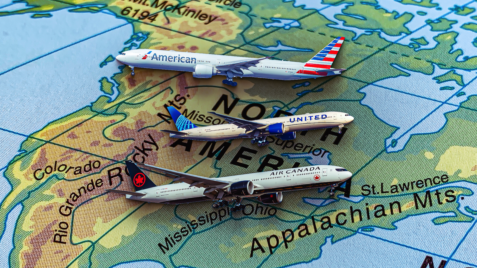 How Do Airline Cabin Layouts On The Boeing 777-300ER Vary Across North American Carriers?