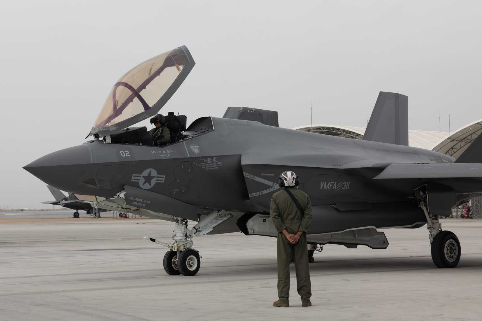 U.S. Marine Corps Capt. Cassandra Touchstone, left, an F-35C Lightning II pilot with Marine Fighter Attack Squadron (VMFA) 311, Marine Aircraft Group 11, 3rd Marine Aircraft Wing, conducts pre-flight checks