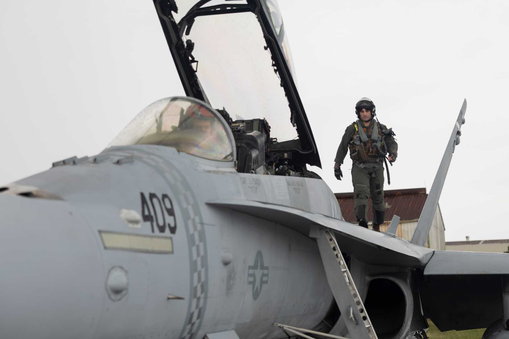 U.S. Marine Corps Maj. Matthew Hamtak, an FA-18 Hornet pilot with Marine Fighter Attack Squadron (VMFA) 312, prepares for flight operations