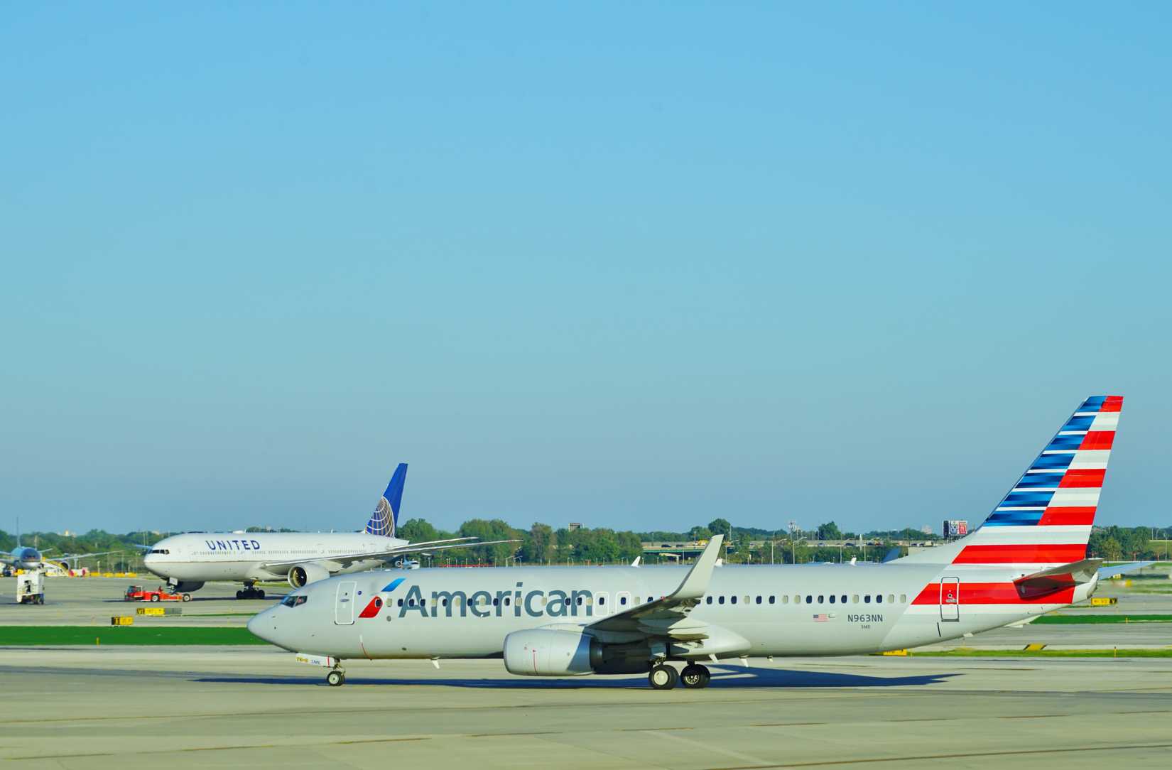 American Airlines and United Airlines aircraft at Chicago O'Hare International Airport ORD shutterstock_1183738369