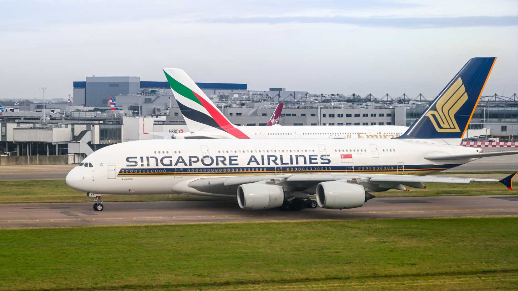 Emirates Airbus A380 and Singapore Airlines Airbus A380 at LHR shutterstock_1672722583-1