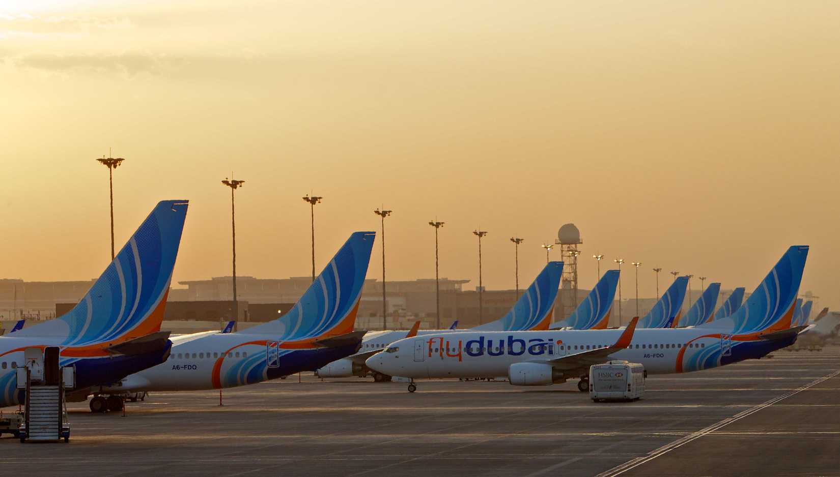 flydubai aircraft parked in line at DXB