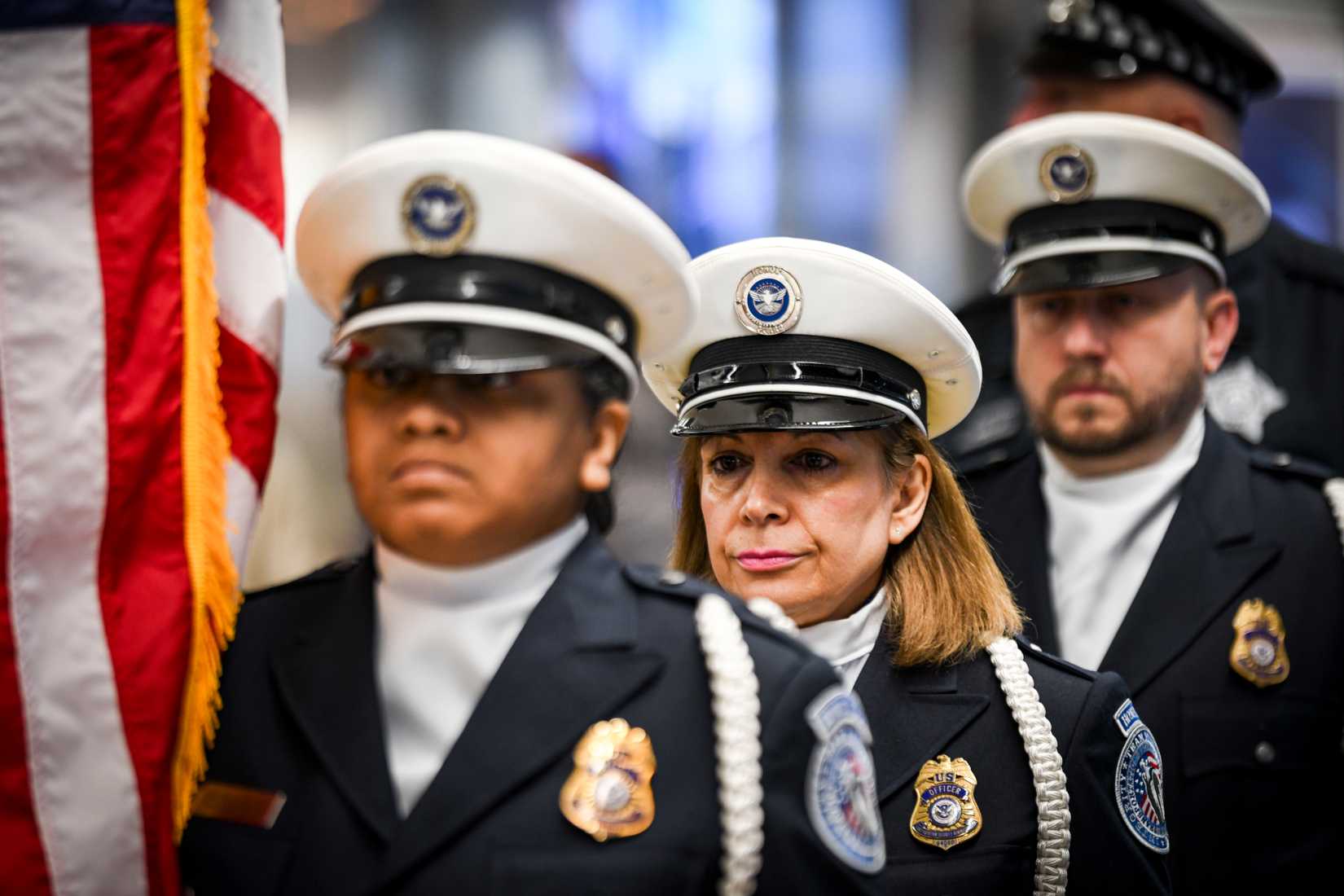 Members of the Transportation Security Administration honor guard parade the colors during a Snowball Express event at Chicago O'Hare International Airport,