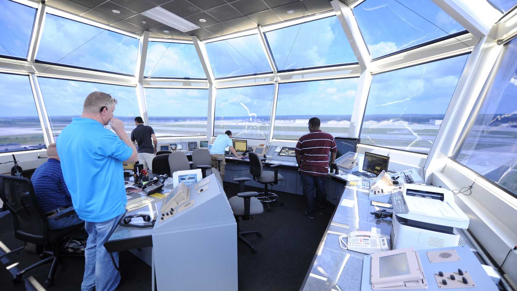 Air traffic controllers direct air and ground operations atop the new air traffic control tower June 11, 2013, at Pope Field, N.C.